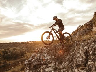 Man riding e bike in mountains